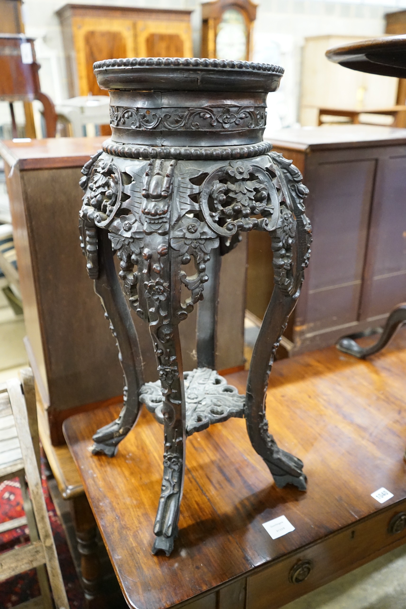 A Chinese carved hardwood marble topped vase stand, width 30cm, height 66cm